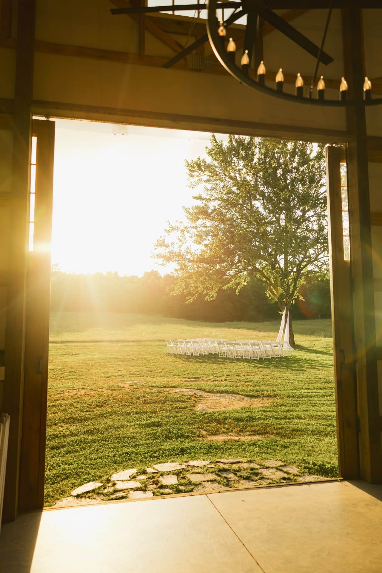 Sunset streaming through the open barn doors