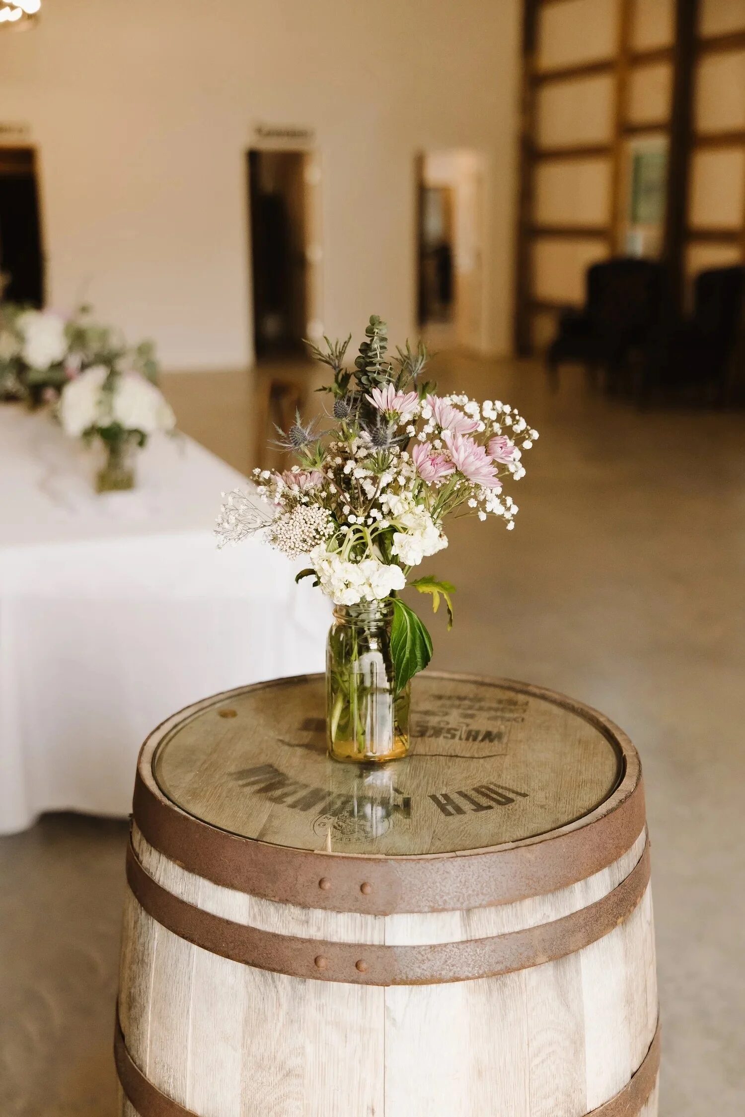 Whiskey barrel styled with florals at the ranch